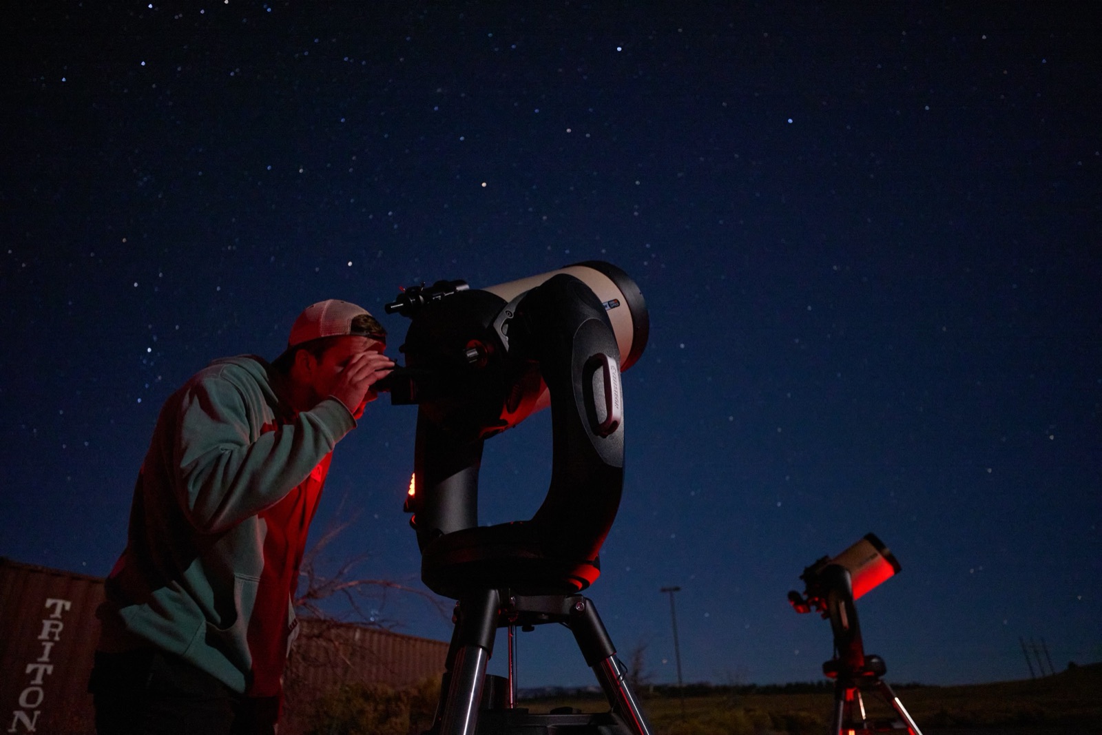 Visitor at a telescope under thousands of stars in Bryce Canyon country