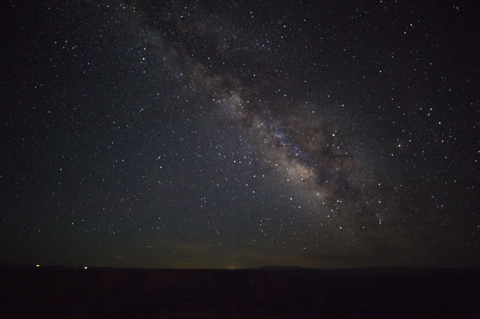 The Milky Way over the dark canyon rim at Dead Horse Point State Park, a certified Dark Sky Park near Moab