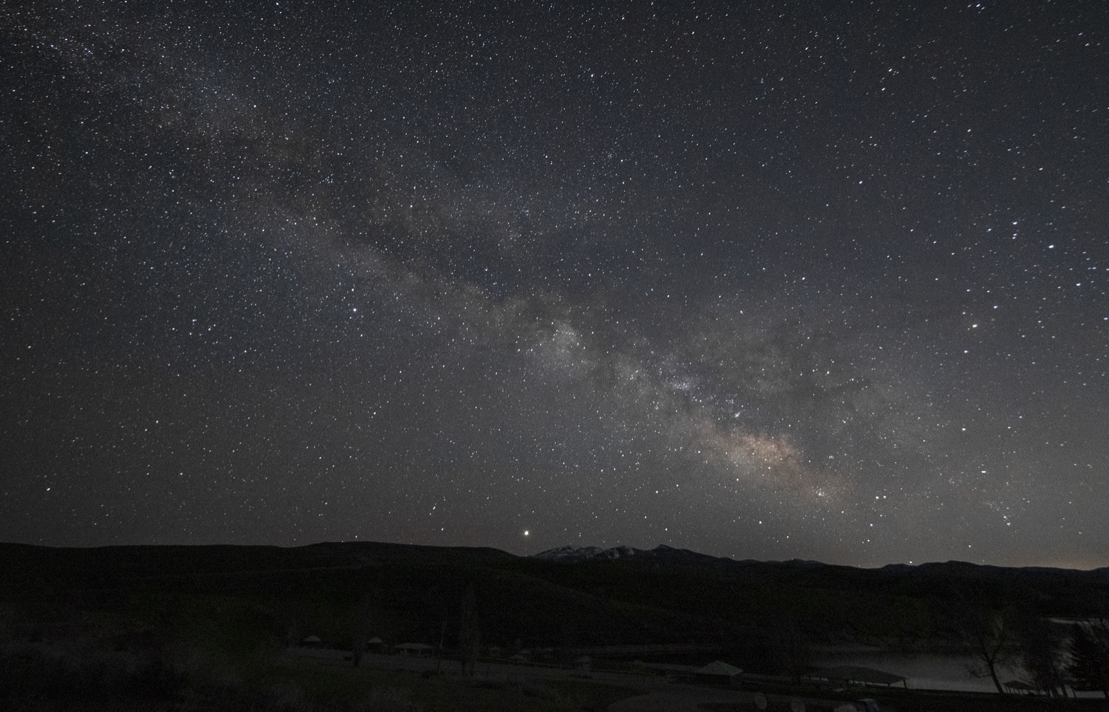 The Milky Way arching over Utah mountains under a certified dark sky